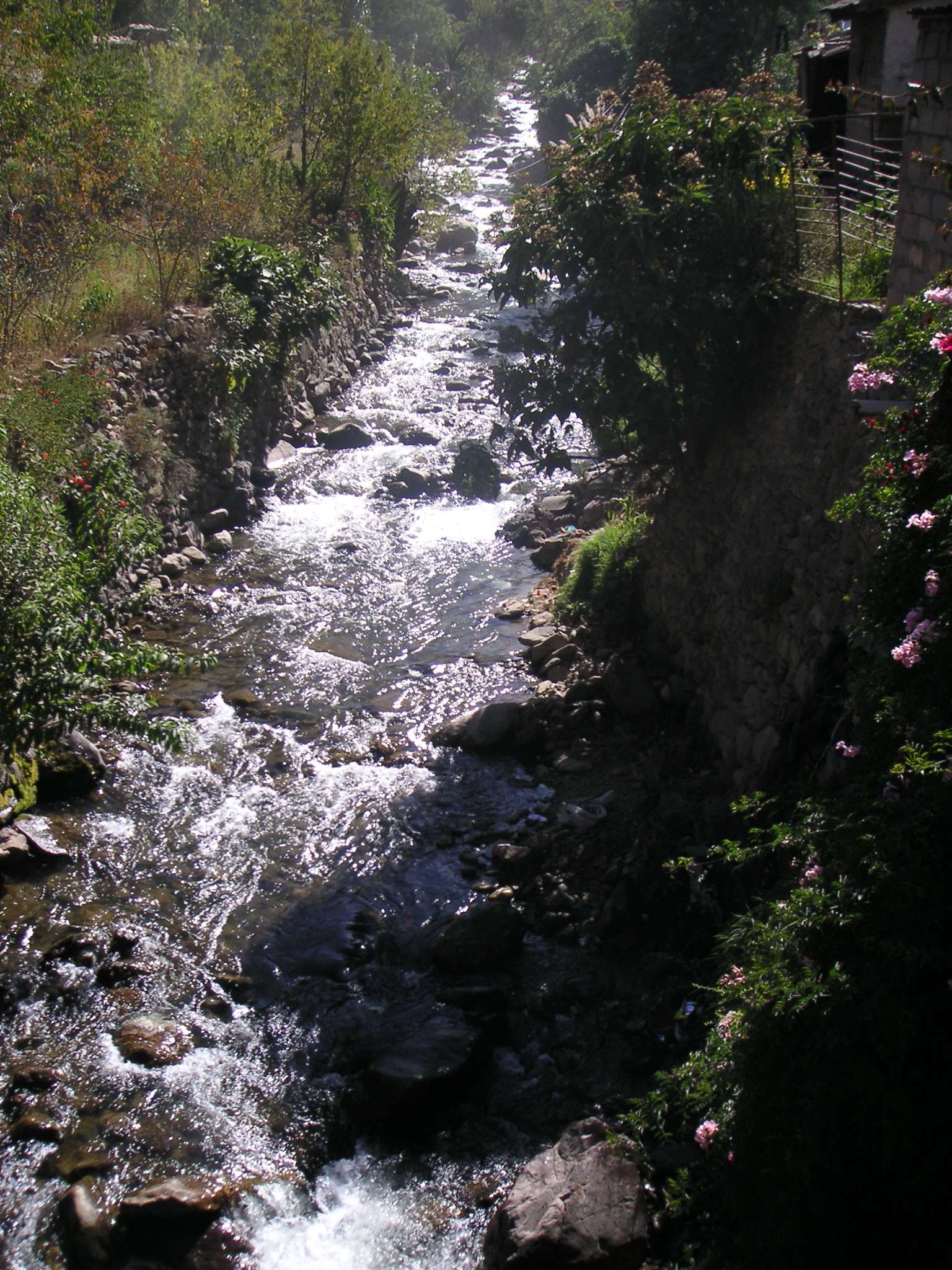 A river running through the town of Ollantaytambo.