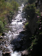 A river running through the town of Ollantaytambo.