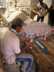 Peruvians packaging salt. This salt is for human consumption.