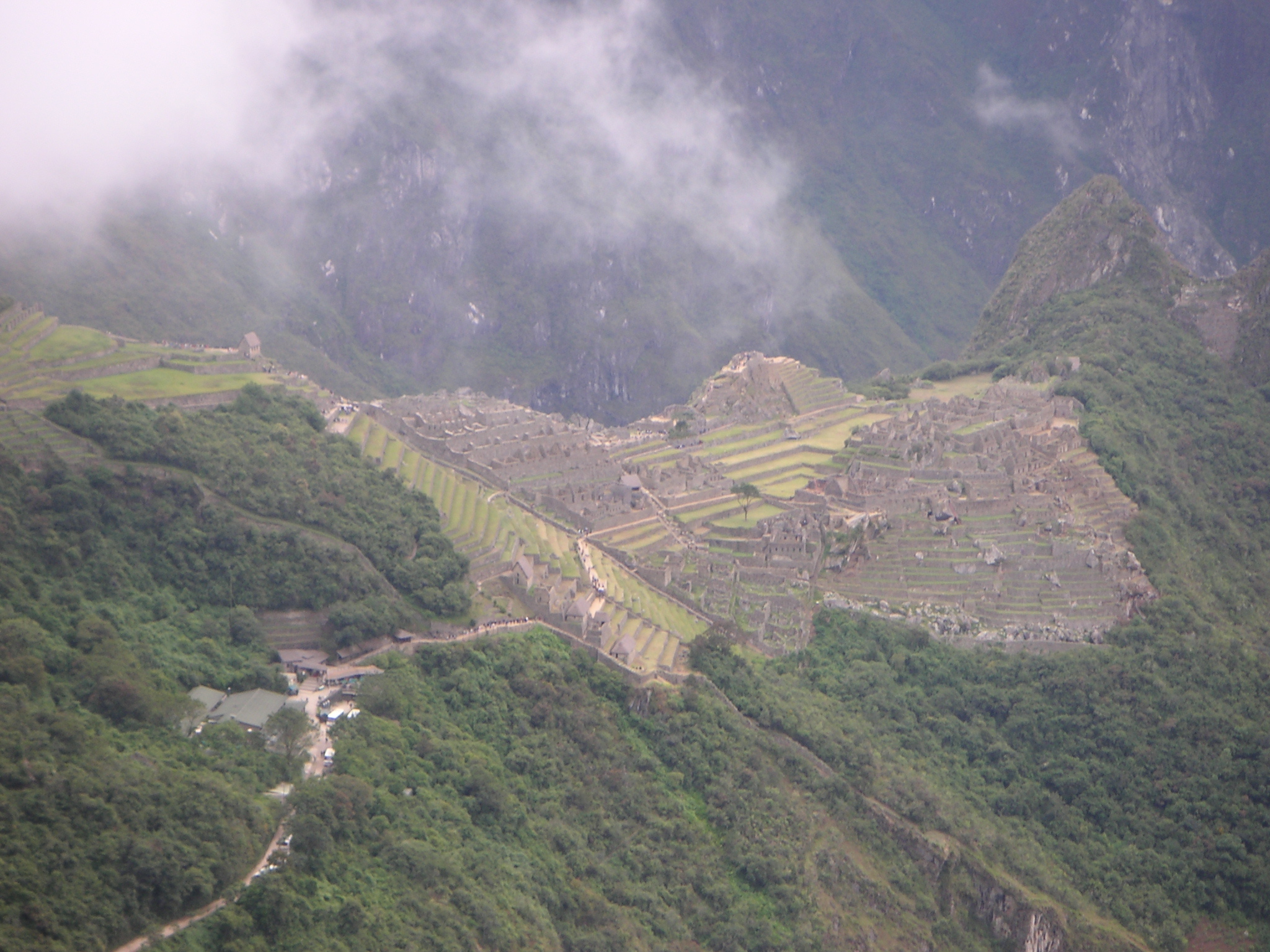 Finally, what everyone has been waiting for! Machu Picchu is seen in the distance, with clouds rolling in.