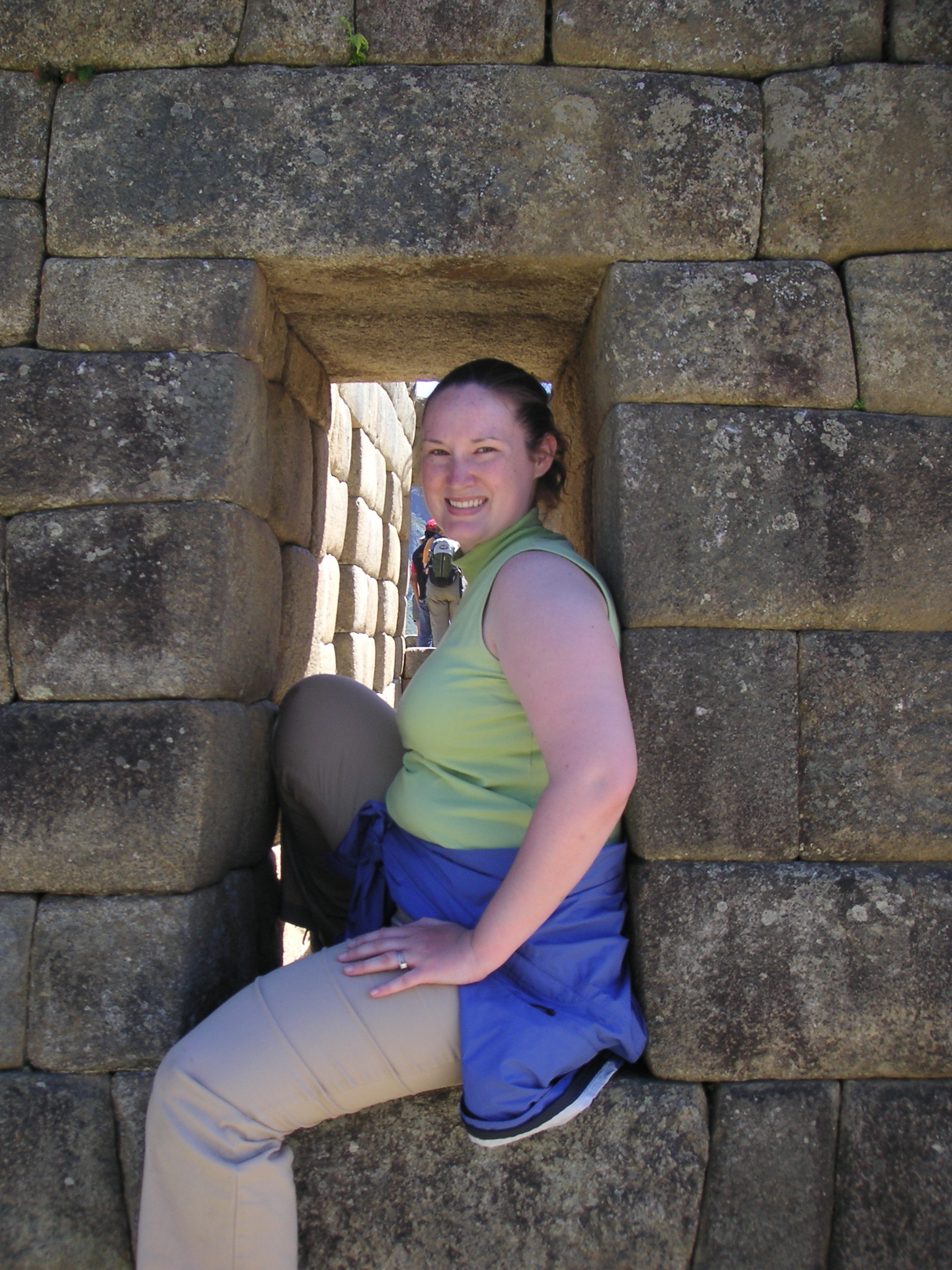 Janet posing in a window at Machu Picchu.