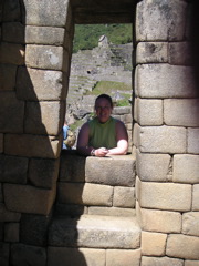 Janet posing in a window at Machu Picchu.