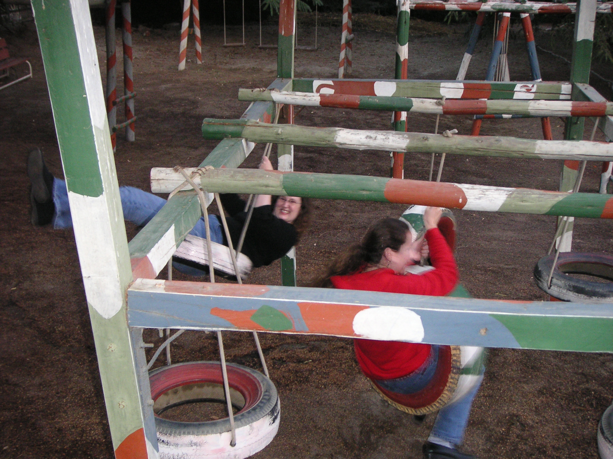 Janet and Jenn on the tire swings at the Hotel-Hacienda Ocucaje.