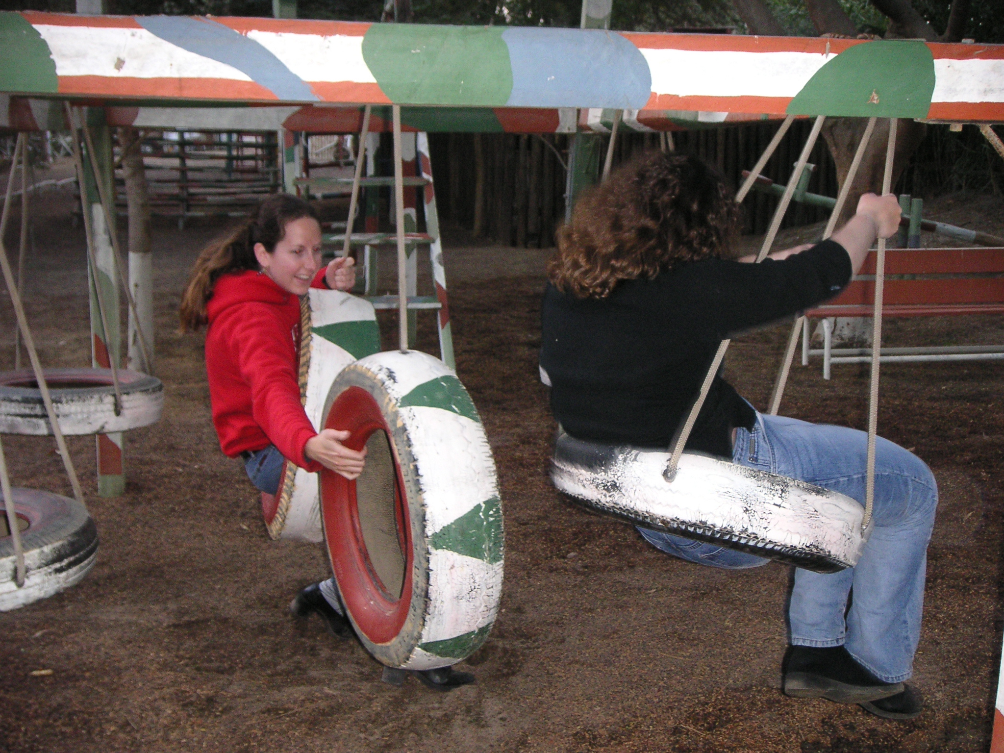 Janet and Jenn on the tire swings at the Hotel-Hacienda Ocucaje.