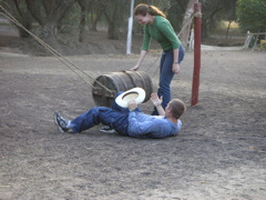 Marianne helps Daniel after he falls off the bucking bronco (Hotel-Hacienda Ocucaje).