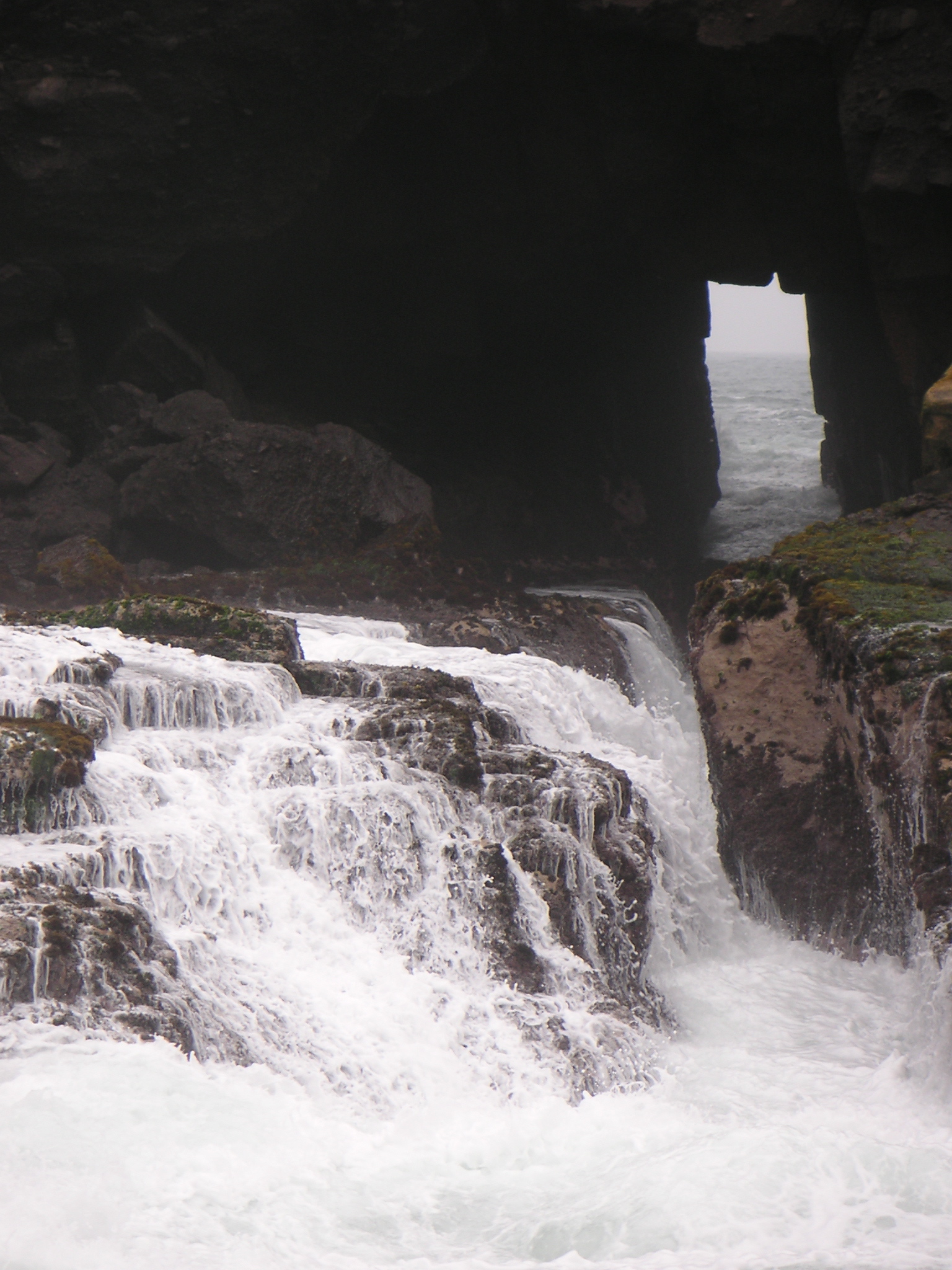 The inlet at Pucusana. Waves come through this small opening and crash over the rocks.