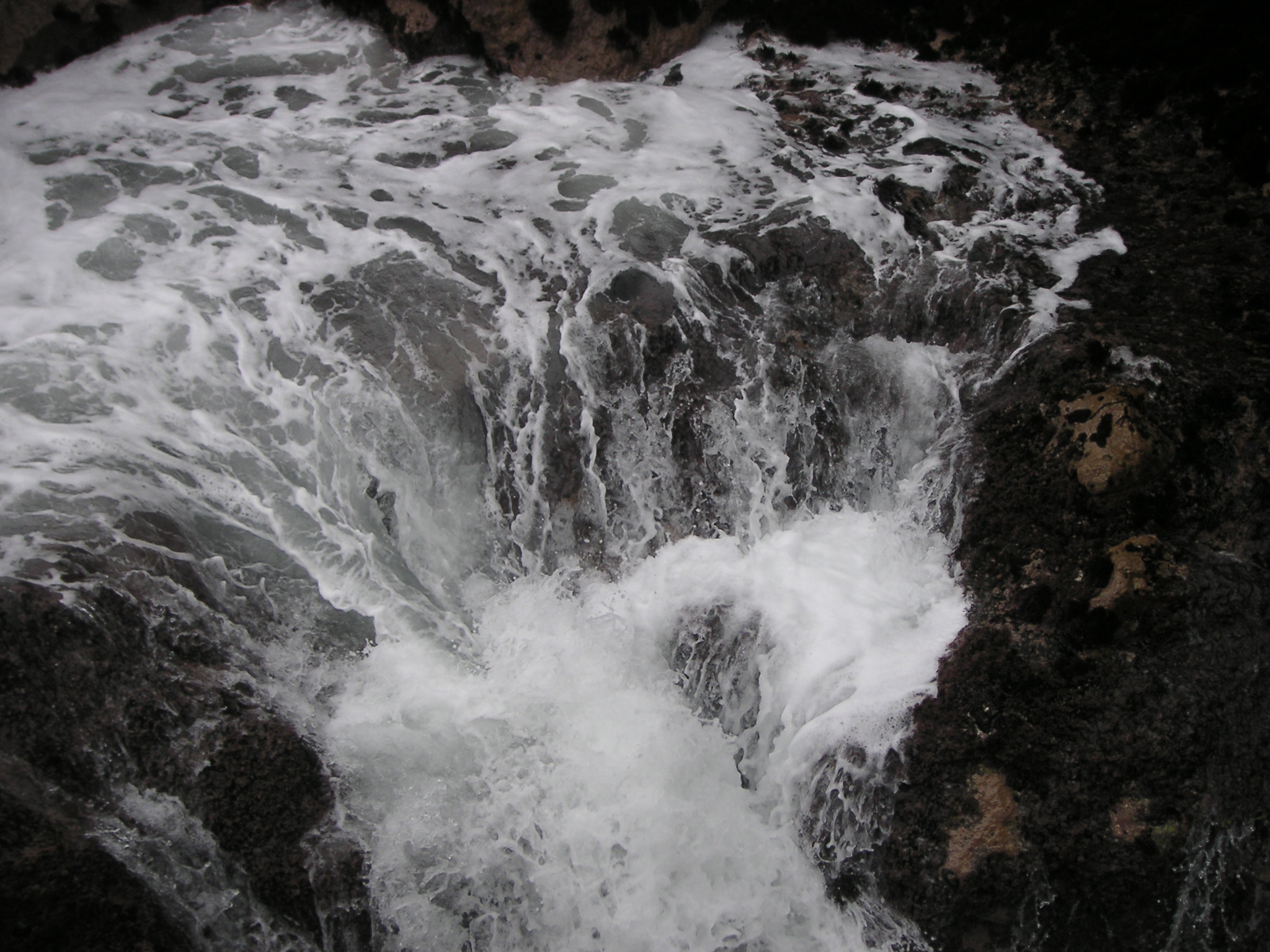 Waves crashing over the rocks at Pucusana.