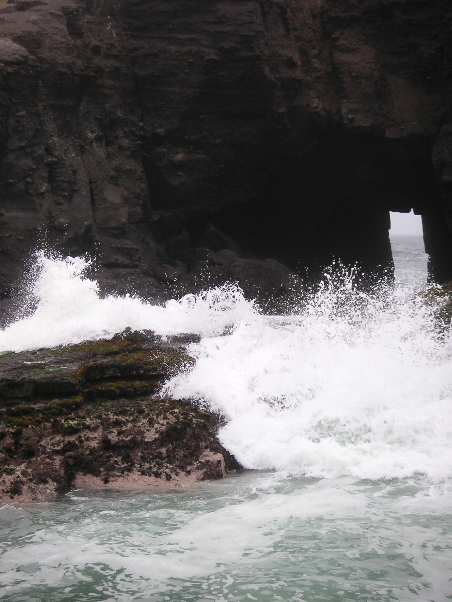 The inlet at Pucusana. Waves come through this small opening and crash over the rocks.