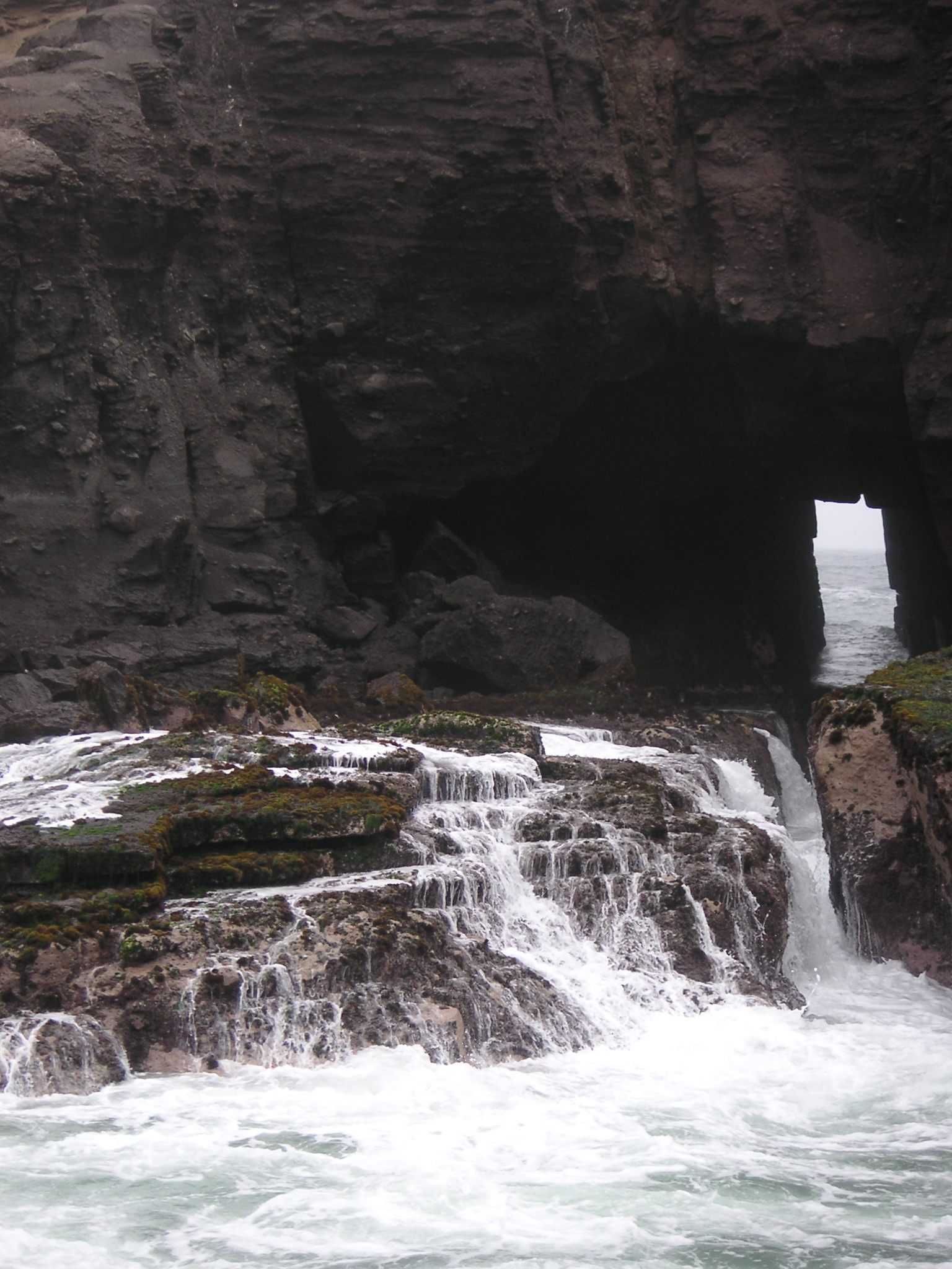 The inlet at Pucusana. Waves come through this small opening and crash over the rocks.